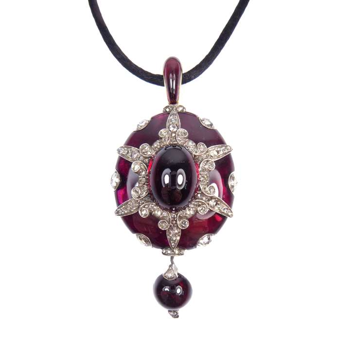 Cabochon garnet and diamond oval cluster pendant-locket